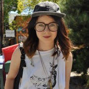 Prudence wearing a American Apparel hat, vintage glasses, and thrifted necklaces.