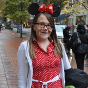 Sarah wearing a mod cloth dress and Minnie Mouse ears.