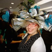 Mitzi was the winner of the hat contest at Portland Meadows Opening Day. Photo by Byron Beck.